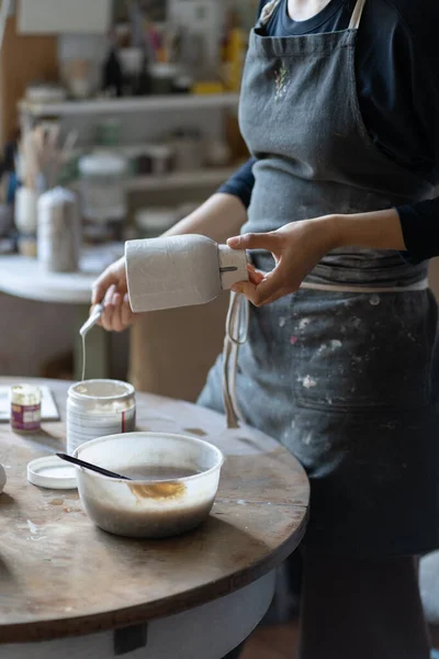 Young Craftswoman Black Apron Paints Clay Vase Paintbrush Baking Handmade — Stockfoto