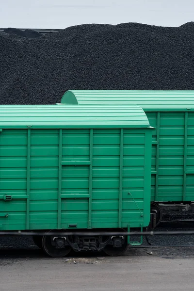 stock image Containers for logistic import export operations of coal and other necessary materials on railway station in dull morning. Freight train transporting production in big cargo containers at terminal