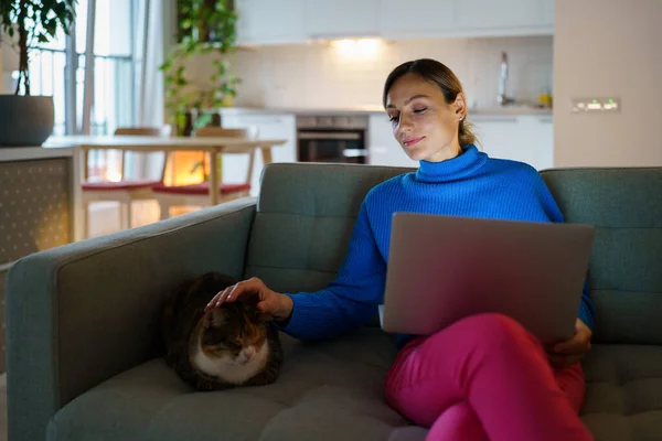 Happy Young Woman Wearing Blue Sweater Works Laptop Types Important — Stock Photo, Image