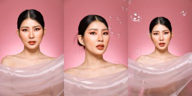 20 'li yaşlarda, Asyalı güzel bir kadının vücut portresi. Siyah saçlı, yüksek moda. Tatlı kız gülümsüyor pembe pastel sabun arka planda pek çok pozun üzerinde uçuyor..