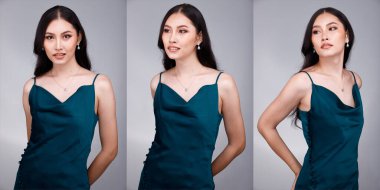 20 'li yaşların Asyalı güzel, bronzlaşmış vücut portresinin yarısı siyah kadın saçı moda yeşil yatak elbisesi giyiyor. Dişi ekspres gülümseme mutlu uyku yatak odasında birçok poz Gri arka plan izole