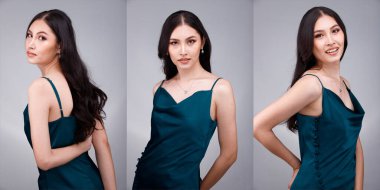 20 'li yaşların Asyalı güzel, bronzlaşmış vücut portresinin yarısı siyah kadın saçı moda yeşil yatak elbisesi giyiyor. Dişi ekspres gülümseme mutlu uyku yatak odasında birçok poz Gri arka plan izole