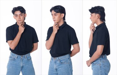 20 'li yaşlarda, Asyalı, bronz tenli, siyah saçlı, kot pantolonlu, izole bir adam. Yakışıklı erkek, beyaz arka plan stüdyosuna bakıp mutlu mesut gülümsüyor.