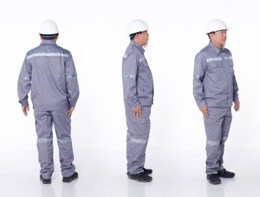 50 'lerin tam boy portresi. 60' ların Asyalı, gri üniformalı yaşlı adam. Elektrik mühendisi, izole edilmiş. Elektrik teknisyeni erkek standı, birçok açıdan dön. Ön taraf arka taraf, beyaz arka plan stüdyosu.