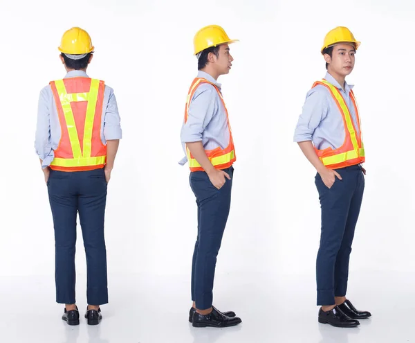 一套全长三顶20多岁的亚洲男人黑头发 身穿安全的大套装 头戴黄色的硬帽 在白色背景隔离的情况下 主动男性立柱作为主管工程师进行维修 — 图库照片