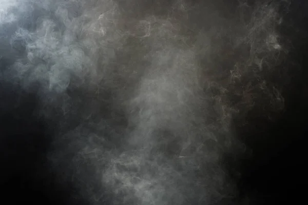 浓密的白色烟雾和黑色背景下的雾气 抽象的烟雾 模糊的运动焦点 干冰和空气中的飞舞产生的烟尘 影响质感 — 图库照片