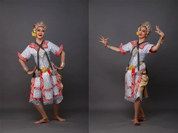 全长亚洲妇女穿着泰国传统服装舞蹈家与美丽的设计服装 孔舞是泰王国的舞台剧 工作室照明与灰色背景隔离 — 图库照片