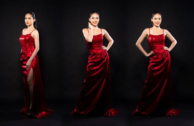 Full length body of Asian beautiful woman wear red evening sequin gown, fashion vintage poses. Young female stand express feeling happy smile strong over black background isolated