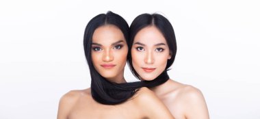 Two 2 Beautiful fresh skin women open shoulder with clean look make up and long black hair. Portrait young girls in attractive natural fashion face express feel smile, isolated white background