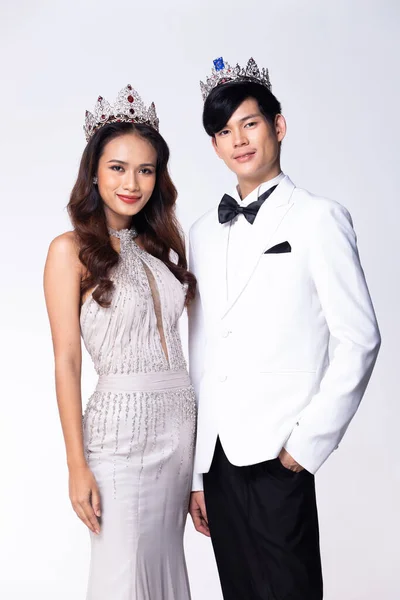 Collage Group half body Figure of 20s Asian two Woman man Miss beauty pageant contest crown, evening gown and suit. Couple stands and pose confident beautiful over white Background isolated