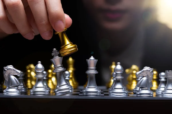 Business woman play Chess with close up Hand. Leader use strategy game to challenge competitor with intelligence leadership to move King to victory with management team idea fight, copy space