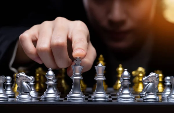 Business woman play Chess with close up Hand. Leader use strategy game to challenge competitor with intelligence leadership to move King to victory with management team idea fight, copy space