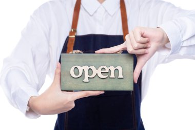 Owner person hold Open Sign Business to show service at door entrance store, cafe, retail and welcome shop. Happy Entrepreneur female wear waitress dress as open business time again concept