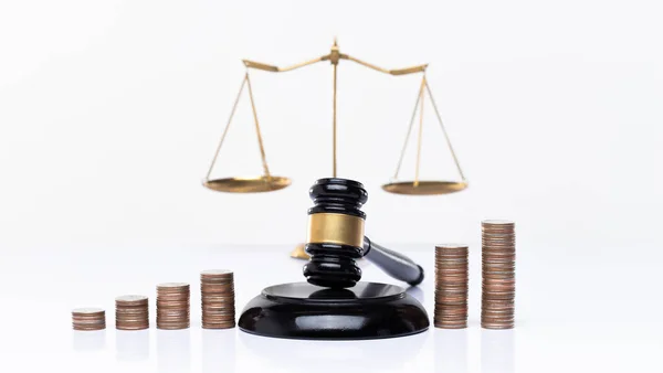 Investment Financial growth of legal and justice education is represented by a gavel-balanced stack of coins graph. Judge Power halt money Corruption in tax payments and laundry concept, copy space