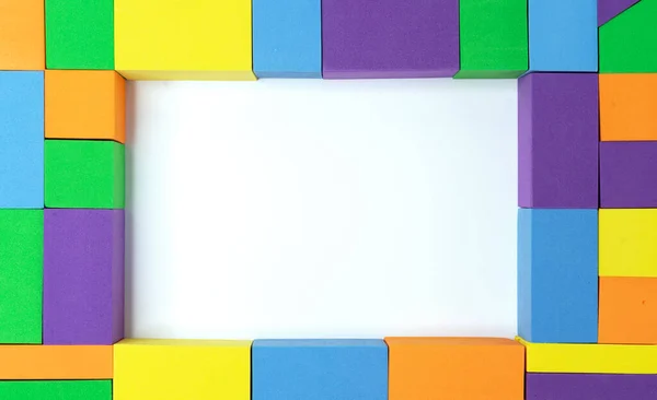 Rahmen Aus Mehrfarbigen Quadraten Rechtecken Und Dreiecken Mit Weißer Mitte — Stockfoto