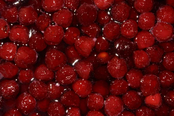 Cooking cherry jam Stock Image