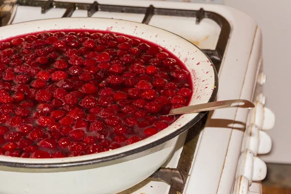 Cooking cherry jam Royalty Free Stock Images