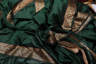 women Traditional Green and Gold Colour Saree Isolated on White Background