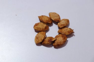  plums Seeds on an isolated white background