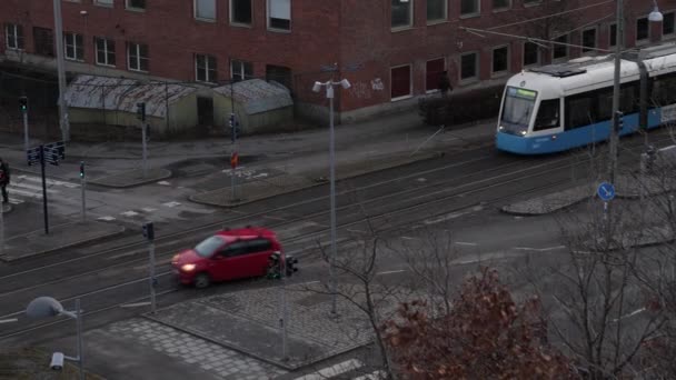 Gothenburg, Sweden- January 10 2021: Tram Slows Down Before Crossing at Kviberg — Stock Video