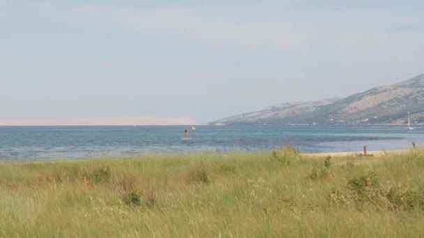 Croatian Coastline Person Sup Boarding Wide Pan High Quality Footage — Vídeos de Stock