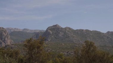 Birds Flying Towards Mountain Range at Paklenica National Park, Dalmatia, Croatia. High quality 4k footage