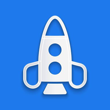 Kağıt kesiği Roket oyuncağı ikonu mavi arka planda izole edilmiş. Uzay yolculuğu. Kağıt sanatı tarzı. Vektör