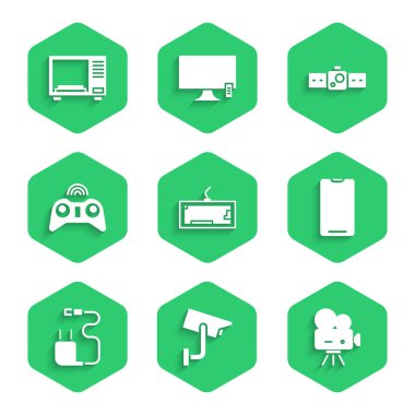 Klavye, güvenlik kamerası, Retro sinema, akıllı telefon, cep telefonu, şarj aleti, kablosuz oyun alanı, Smartwatch ve mikrodalga fırın ikonu. Vektör