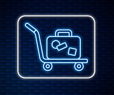 Parlayan neon hattı Trolley bavul ikonu tuğla duvar arka planında izole edildi. Seyahat bagaj tabelası. Seyahat bagaj ikonu. Vektör