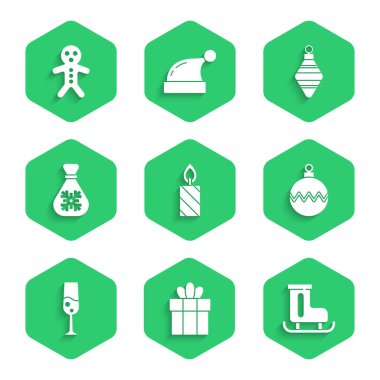 Yanan mum, hediye kutusu, figür patenler, Noel balosu, şampanya kadehi, Noel Baba çantası hediyesi ve zencefilli kurabiye ikonu. Vektör