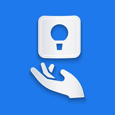 Kağıt, mavi arkaplanda izole edilmiş fikir ikonu kavramına sahip ampulü kesti. Enerji ve fikir sembolü. İlham konsepti. Kağıt sanatı tarzı. Vektör.