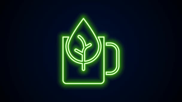 Glowing neon line Cup of tea with leaf icon isolated on black background. Sweet natural food. 4K Video motion graphic animation — стоковое видео