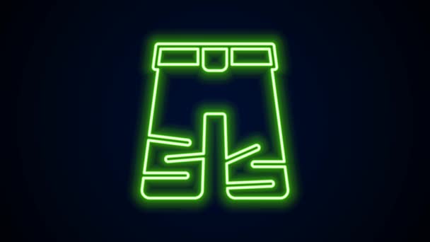 Glowing neon line Wide pants icon isolated on black background. Trousers sign. 4K Video motion graphic animation — стоковое видео