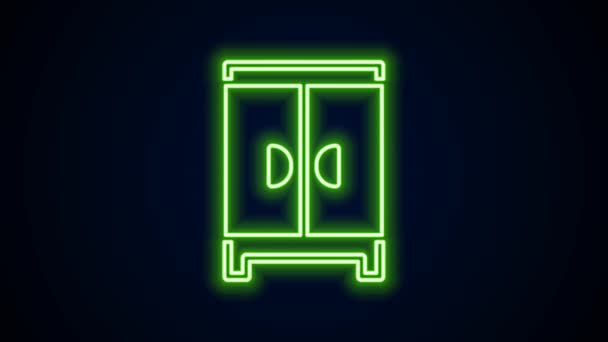 Glowing neon line Wardrobe icon isolated on black background. Cupboard sign. 4K Video motion graphic animation — Video