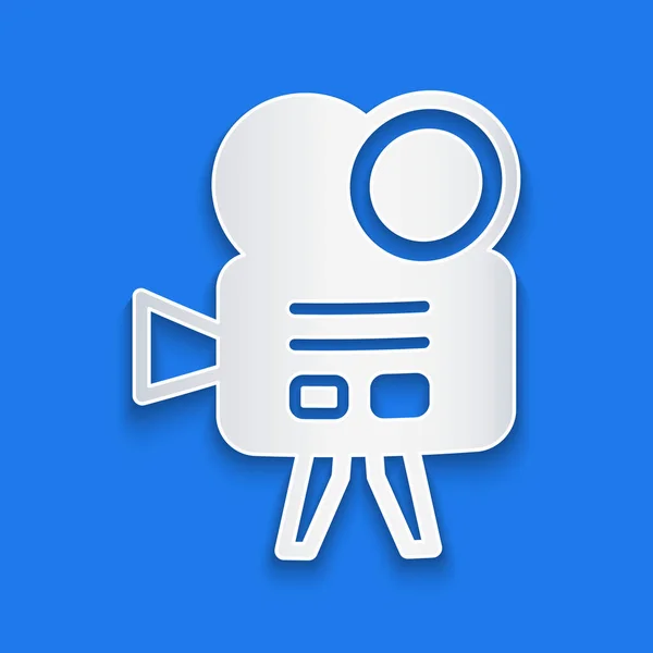 Papier gesneden Retro bioscoop camera pictogram geïsoleerd op blauwe achtergrond. Video camera. Filmbord. Film projector. Papierkunst stijl. Vector — Stockvector