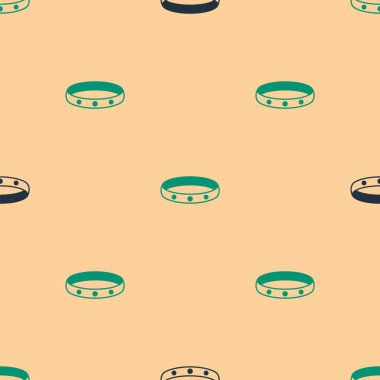 Yeşil ve siyah altın yüzük ikonu, bej arkaplandaki kusursuz deseni izole etti. Vektör.