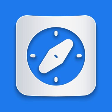 Kağıt kesiği Pusula simgesi mavi arkaplanda izole edildi. Rüzgâr yön bulma sembolü. Rüzgar gül işareti. Kağıt sanatı tarzı. Vektör.