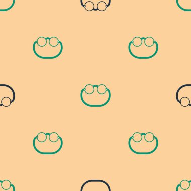 Yeşil ve siyah gözlük ikonu bej arka planda izole edilmiş pürüzsüz desen. Vektör.