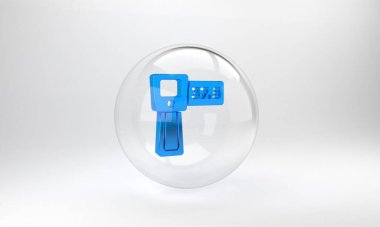 Gri zemin üzerinde kızılötesi ışık ikonu olan mavi dijital temassız termometre. Cam daire düğmesi. 3 Boyutlu resimleme.