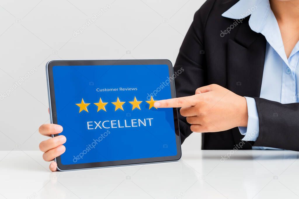 Woman hand pointing to five-star on tablet showing satisfaction excellence customer, Customer satisfaction concept. 