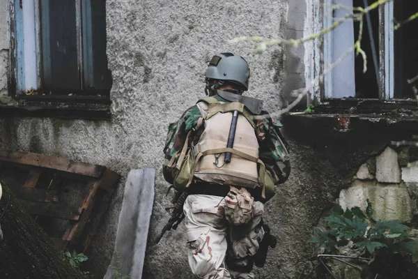airsoft game, guy in american uniform during the game