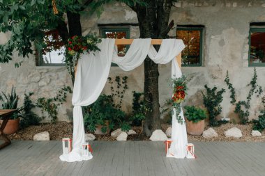 wedding location. simple rustic decorated wedding arch. High quality photo