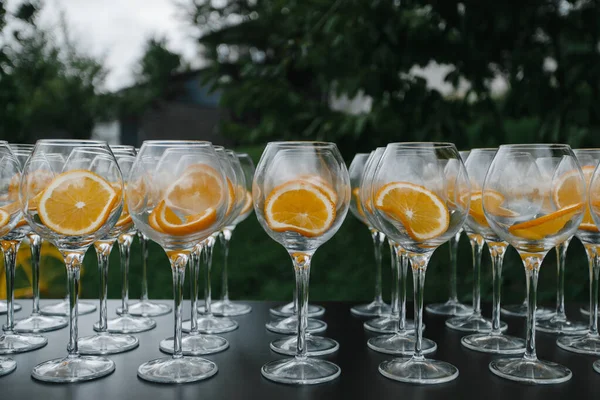 garden party. outside bar. empty glasses in a row waiting for the drinks. High quality photo