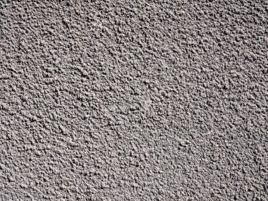 Grunge textured orange plaster texture background.