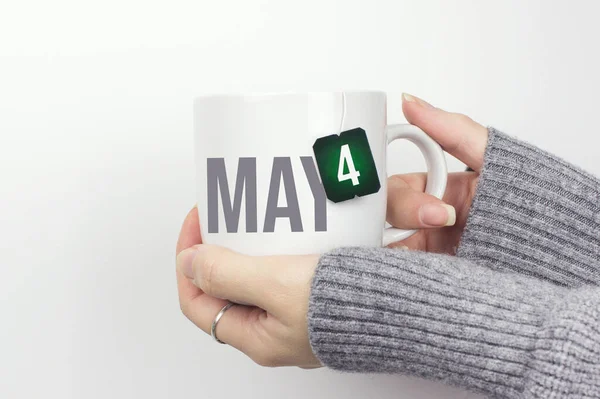 May 4Th Day Month Calendar Date Closeup Female Hands Grey — Stockfoto