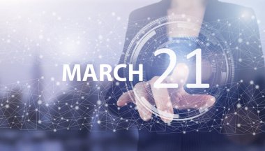 21 Mart. Ayın 21 'i, takvim tarihi. Açık mavi arka planda el tıklama hologram takvimi tarihi. Bahar ayı, yılın günü konsepti.