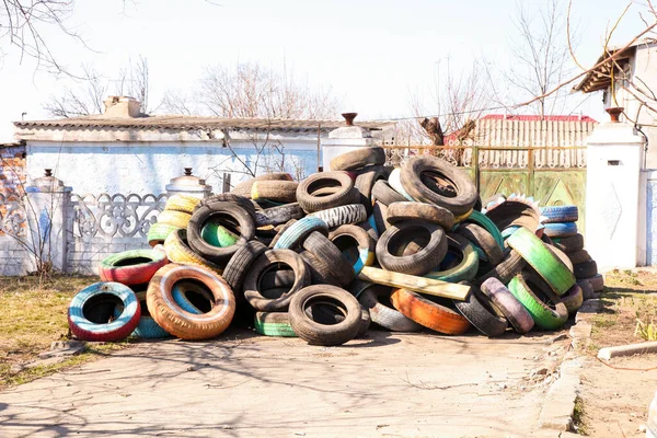 Pile of old tires on the street. Protection from the enemy. War in Ukraine.