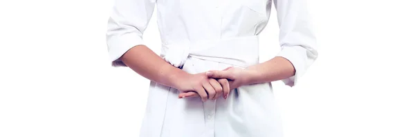 흰 코우 트 를 두른 의사의 팔을 독자적 인 배경 위에 교차 시킨 모습 스톡 이미지
