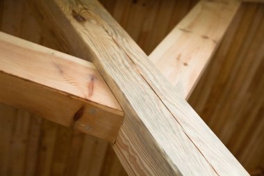 Wooden post with struts. Wooden construction. Wooden framework. 