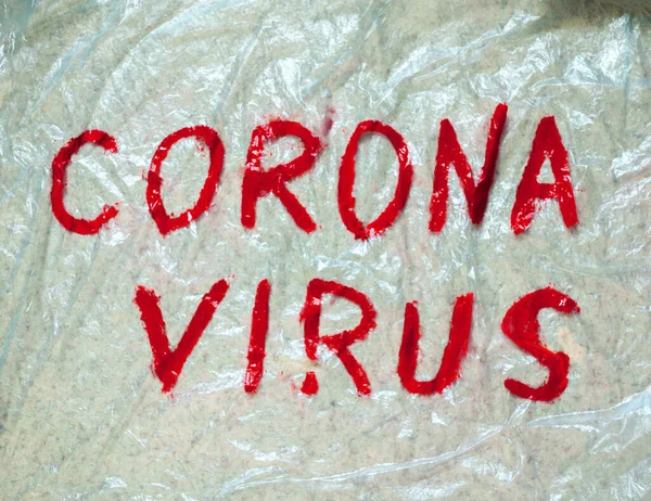 Corona Virus inscription on a polythene. Coronavirus (Covid-19) disease outbreak.
